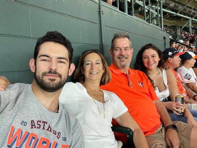 Mary Bordeaux and her family attend a Houston Astros game. She said one of the difficult things about recovery is not being able to take a break from breast cancer such as when she was confronted with a Breast Cancer Awareness Month ad on the jumbotron at the first baseball game she went to after treatment. However, she said, she and her family still enjoy watching the Astros on the field, but she does encourage people to be sensitive to the trauma of breast cancer. From left to right: Tollie Bordeaux, Mary Bordeaux, Danny Bordeaux and Emma Bordeaux.